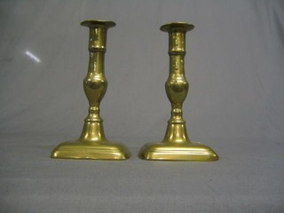 A pair of 18th Century brass candlesticks with ejectors 7"