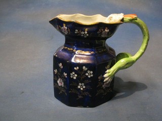 A blue glazed Masons ironstone octagonal shaped jug with floral decoration and dragon handle, the base impressed Masons China (slight chip to base) 8"