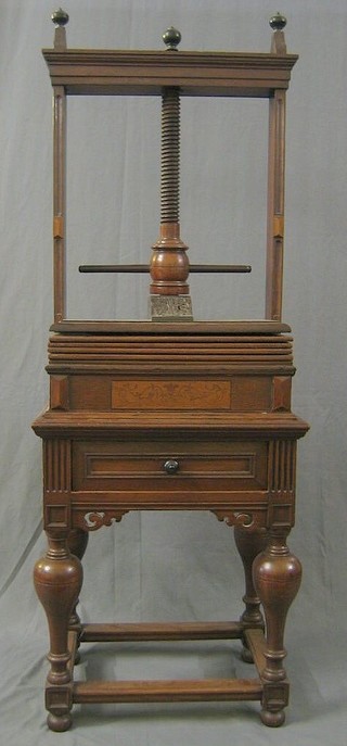 An 18th Century oak book press on a somewhat later stand, fitted a drawer, raised on bulbous turned supports with box framed stretcher 25"