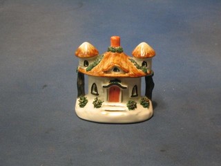 A 19th Century Staffordshire pastel burner in the form of a cottage 4"