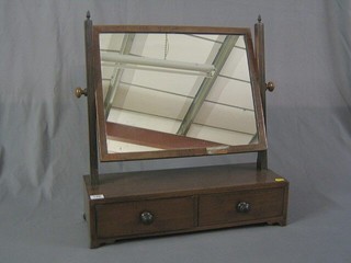 A 19th Century rectangular plate dressing table mirror contained in a mahogany swing frame, the base fitted 2 drawers, raised on bracket feet 22"