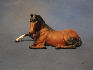 A Beswick matt finished figure of a seated bay horse 10"