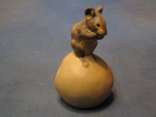 A Poole Pottery figure of a seated mouse on an apple, base marked Poole England 5"