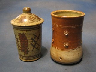 A Raymond Finch circular pierced Art Pottery straining vase 6" and a circular  Art Pottery jar and cover 6"