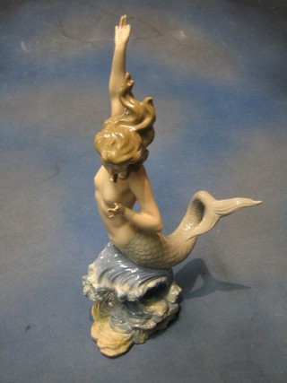 A  Lladro figure of a mermaid, the base marked 5/11 (3 fingers f)  17"