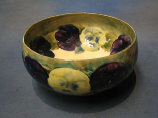 A Moorcroft pottery Pansy pattern bowl (f and r, interior crazed) base with signature mark Moorcroft Burslem, 9"