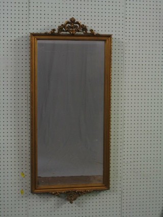 A 19th Century rectangular plate wall mirror contained in a gilt frame 36"