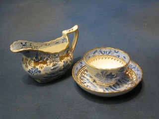 A 19th Century blue and white cream jug, matching tea bowl and saucer together with a porcelain blue and white cup and saucer, 2 porcelain coffee cans and a saucer