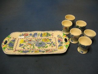 A  Masons Regency pattern twin handled sandwich tray 11" and 6 Regency pattern egg cups