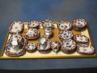 A childs Victorian 46 piece Masons Ironstone style dinner service comprising: 2 graduated meat plates 7" and 6", 2 meat plates 5", lozenge shaped twin handled tureen and cover 6", 2 oval dishes 5 1/1", a sauce boat 3 1/2", 2 twin handled tureens and covers 3", an octagonal tureen and cover 4 1/2", octagonal bowl 2 1/2", pedestal bowl 4", 2 lozenge shaped meat plates 4", sauce ladle 5", small sauce ladle 4" (f), 12 dinner plates 4", 6 soup bowls 4", 6 side plates 3 1/2" and 6 saucers 3", the bases marked 6772
