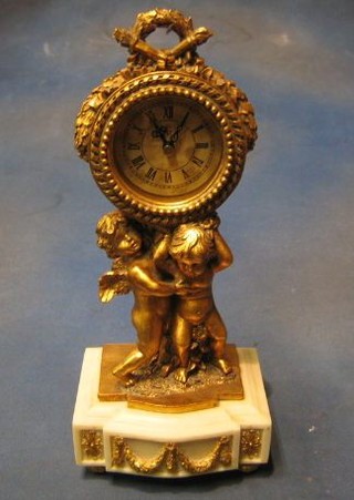 A reproduction Louis XVI table clock with Arabic numerals contained in a gilt case supported by cherubs