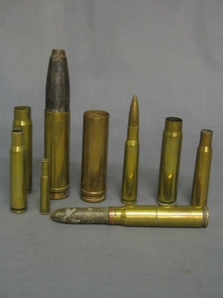 8 various cannon shell cases and 1 other bullet case