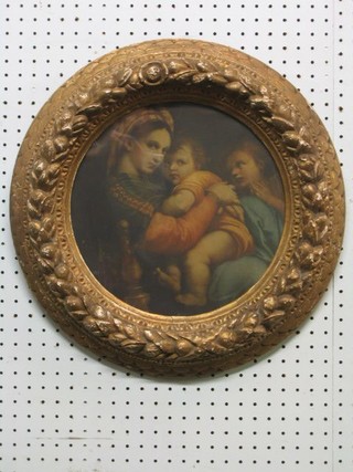 A 19th Century coloured print "Madonna and Child" contained in a circular plaster frame 12"