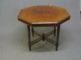 A Victorian rosewood octagonal occasional table raised on turned supports bobbin turned X framed stretcher 36"