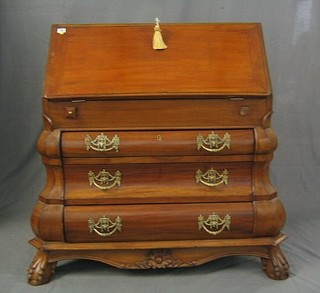 A walnut Bombay shaped bureau, the fall front revealing a well fitted interior above 3 long drawers, raised on ball and claw supports 36"