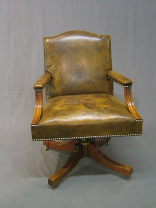 A Georgian style mahogany and leather open arm office chair 