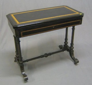 A Victorian aesthetic movement ebonised lozenge shaped card table with figured walnutwood inlay, raised on turned and fluted supports with H framed stretcher 33"