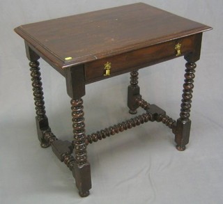 A Jacobean style elm side table/low boy fitted a drawer, raised on bobbin turned supports with H framed stretcher 31"