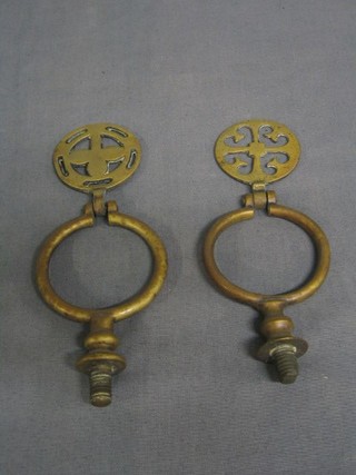 A pair of pierced brass heavy horse swingers