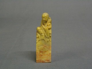 A carved Oriental soap stone seal decorated a deity 4"
