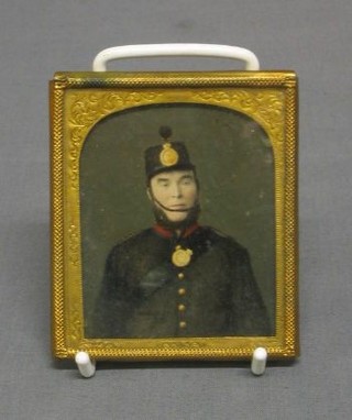 An early 19th Century colour photograph of a soldier, contained in a arched frame 3" x 2 1/2"