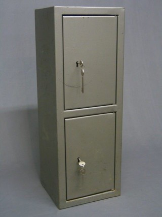 A metal double pistol/ammunition cabinet safe 29" x 11" x 10" with 2 sets of keys