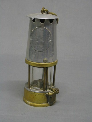 A miner's Davey lamp  by The Protector Lamp & Lighting Co.