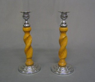 A pair of bleached oak spiral turned candlesticks with chromium plated mounts 10"
