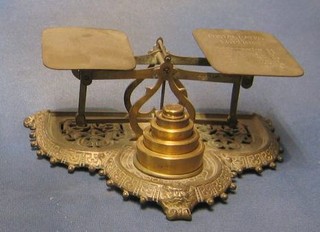 A pair of 19th Century pierced brass postage scales the base marked Townshend & Co with non matching weights,