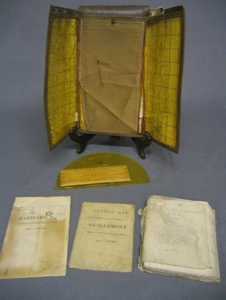 A leather map case containing 2 WW1 trench maps, other maps etc