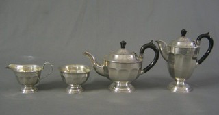 A 1950's 4 piece cylindrical silver plated tea service with teapot, hotwater jug, sugar bowl and cream jug