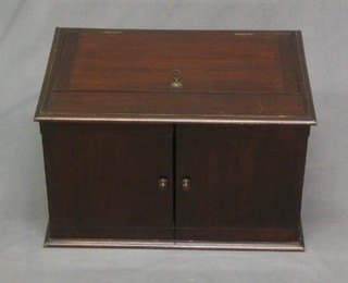 A mahogany cabinet with hinged lid