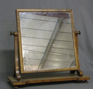 A 19th Century rectangular plate dressing table mirror contained in a mahogany swing frame