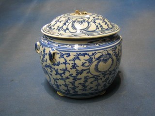 An Oriental circular blue and white porcelain jar and cover (lid f) 7"