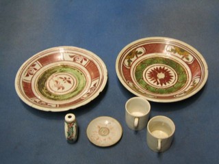 A pair of 19th Century Oriental porcelain plates with red and floral banding 8" (chips to rim), a reproduction snuff bottle 2", a circular saucer 3" and 2 porcelain coffee cans