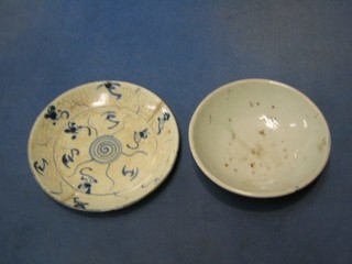 A 19th Century Oriental porcelain saucer with blue and white decoration 6 1/2" and a later blue and white pedestal bowl 6"