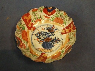 A 19th Century circular Japanese Imari porcelain bowl with lobed body 8 1/2" (slight chip to rim)