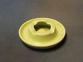 A circular green glazed Royal Doulton ashtray, the base marked BISN Co 6"