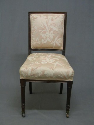 A pair of Edwardian mahogany show frame standard chairs with upholstered seats on backs, on turned and reeded supports