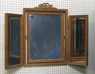 A triple plate dressing table mirror contained in a gilt frame
