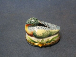 A Limoges porcelain pill box in the form of a seated bird 3"