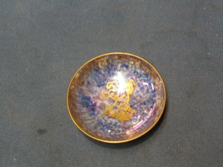 A circular Wedgwood orange lustre bowl, the centre decorated a dragon, 3"