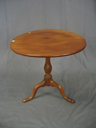 A 19th Century fruitwood circular snap top tea table, raised on bulbous turned and tripod supports (r) 30"