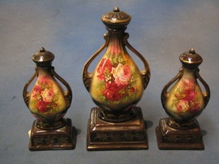 An Edwardian garniture of 3 twin handled vases 10" and 7"