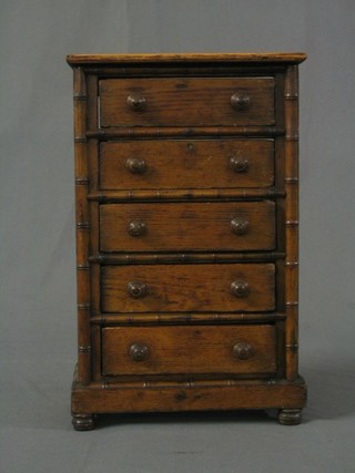 A 19th Century apprentice faux bamboo pine chest of 5 long drawers with tore handles and bun feet 10"