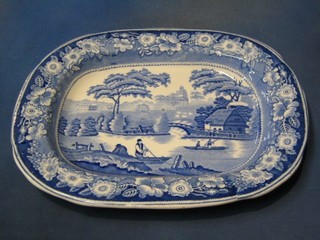 A 19th Century blue and white meat plate decorated landscapes with figures in boats 16"