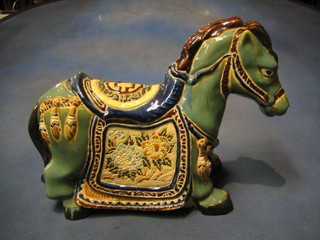 An Oriental style pottery figure of a horse 15"