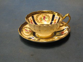 A set of 6 Paragon china cups and saucers with gilt blue and floral decoration