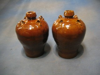 A pair of Oriental brown glazed pottery 4 handled  flasks 9"