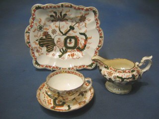 A Charles Mason 26 piece tea service comprising 2 twin handled bread plates, sugar bowl, milk jug (crazed), 11 cups (2 cracked), 11 saucers (5 cracked)